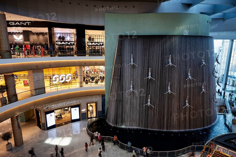 Interior view, The Waterfall, artificial indoor waterfall with life-size jumper sculptures, installation on the pearl diving tradition, Dubai Luxury Shopping Mall, luxury shopping centre, Downtown, Dubai, United Arab Emirates, VAR, Asia