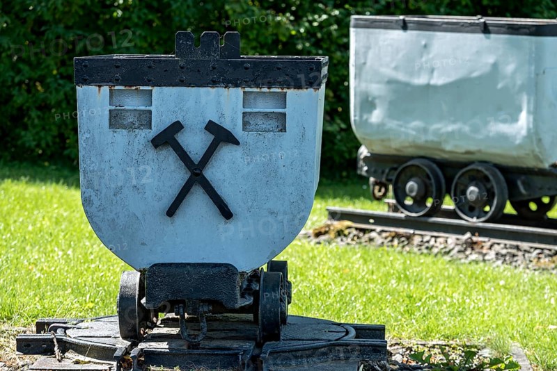 Trolleys for transporting brown coal underground, mining, mine wagon with hammer and iron symbol, wagon, open-air museum at Weckesheim railway station, Reichelsheim, Wetterau, Hesse, Germany, Europe