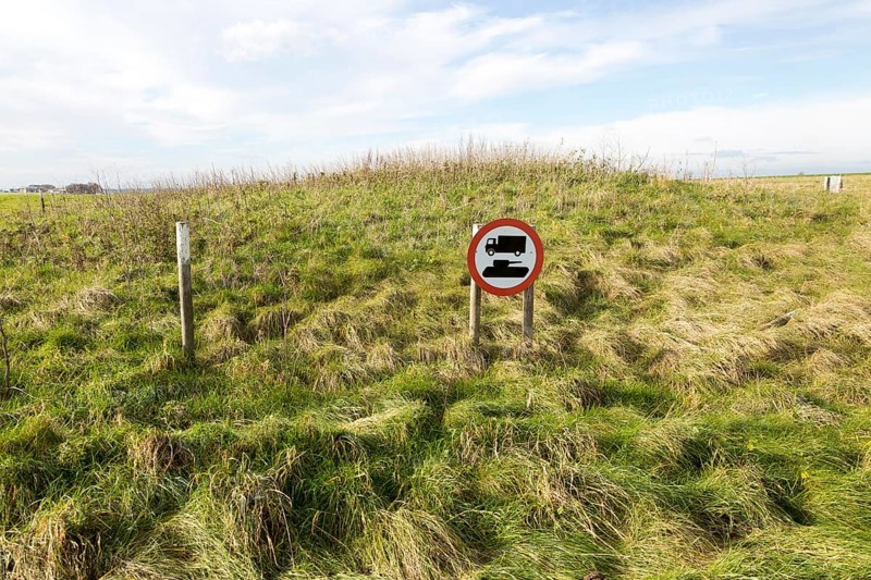 Protective sign warning against military vehicles at an archaeological site on Salisbury Plain, Wiltshire, England, UK