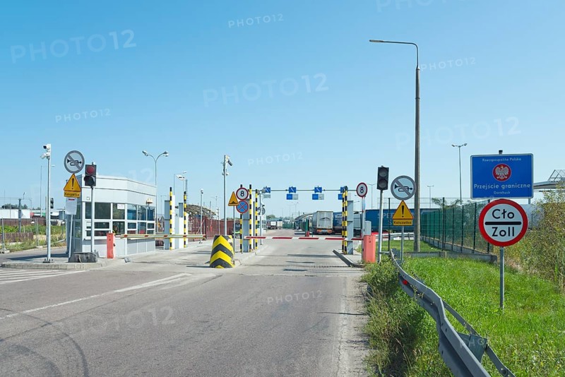 Customs station with open barrier and traffic signs on a sunny day, border from Poland to Ukraine, Dorohusk, Chelmski, Lublin, Poland, Europe