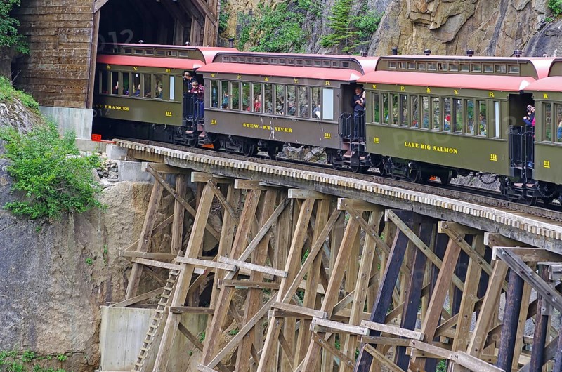 Historic railway carriages on an old wooden bridge, White Pass Railway, wilderness, mountain landscape, White Pass Railway, Skagway, Alaska, USA, North America
