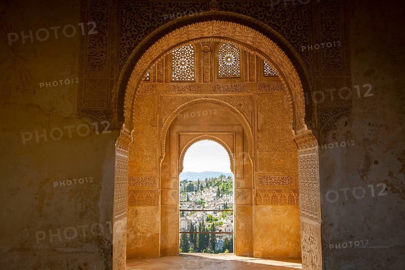 Stone arches in Islamic key shape in the Generalife palace, Alhambra, Granada, Spain, Europe