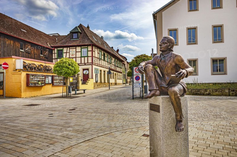 Joseph Victor von Scheffel monument and Bahnhofstrasse in Bad Staffelstein, Bavaria, Germany, Europe