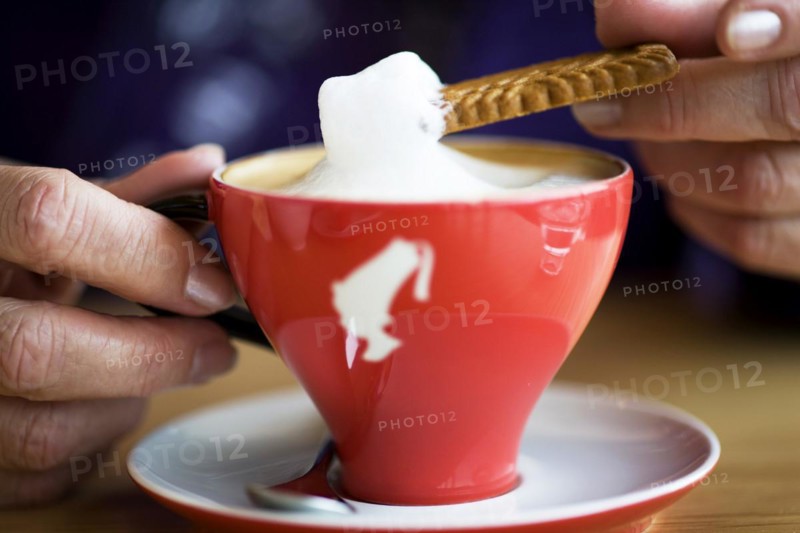 Cup of cappuccino, coffee drink, frothed milk, cream, pastry