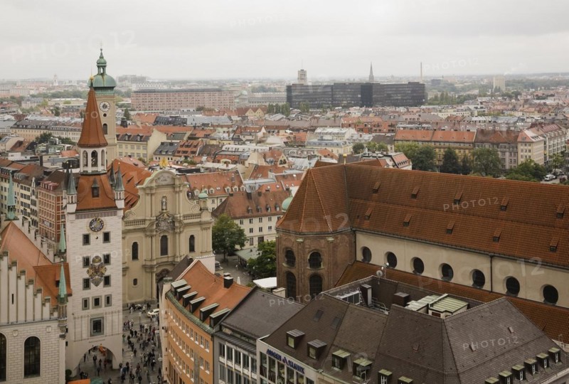 High angle view of buildings with traditional terracotta ceramic tiled rooftops surrounding the Marienplatz Square, Munich, Bavaria, Germany, Europe