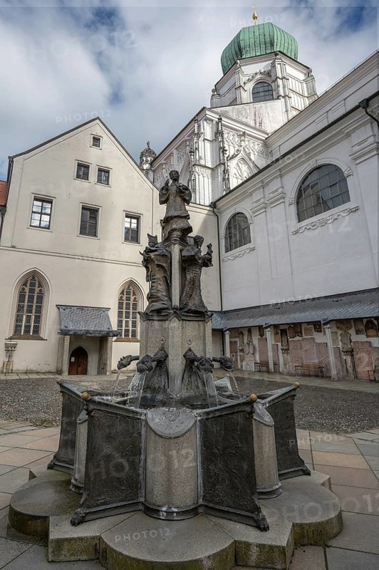 Patronal fountain created in 1978 by the artist Leopold Hafner, in the courtyard of St Stephen's Cathedral, Passau, Lower Bavaria, Bavaria, Germany, Europe