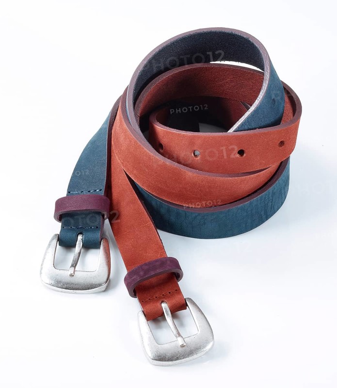 Leather belt in front of a white background, studio shot