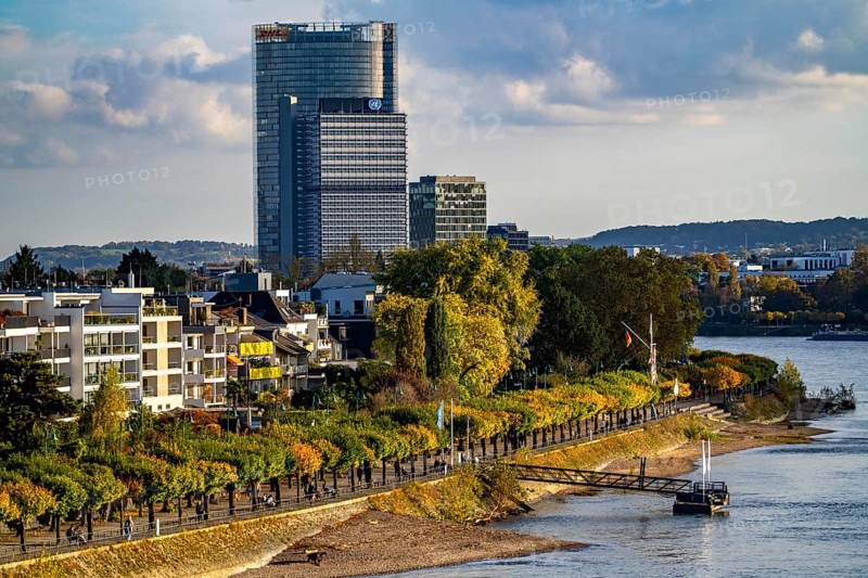Skyline Bonn on the Rhine, in front the UNFCCC Secretariat of the Framework Convention on Climate Change, in the centre the United Nations high-rise building, Campus Bonn, behind it the Posttower, headquarters of Deutsche Post, Rhine bank Bonn-Beuel, riverside promenade, North Rhine-Westphalia, Germany, Europe