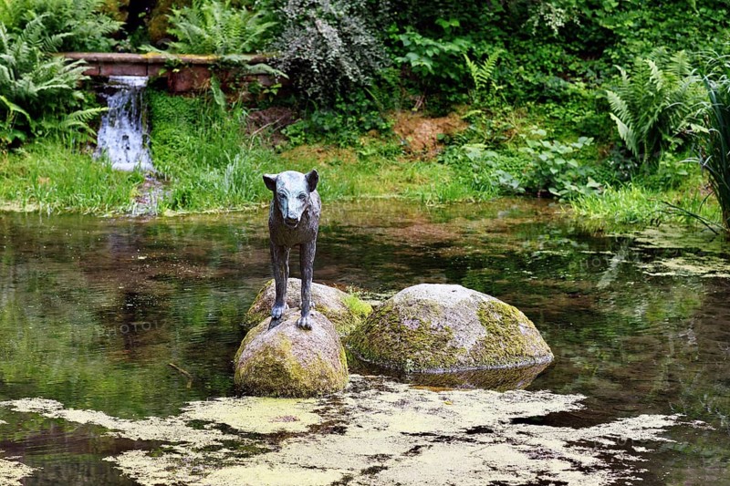 Heidelberg, Germany, June 8th 2024: Wolf sculpture at historic well called 'Wolfsbrunnen' in Heidelberg Schlierbach, Europe