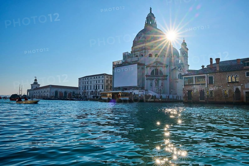 View from a gondola on 'Basilica the Santa Maria della Salute' next to Canal Grande' in Venice on a quiet and sunny morning in winter, Italy, Europe