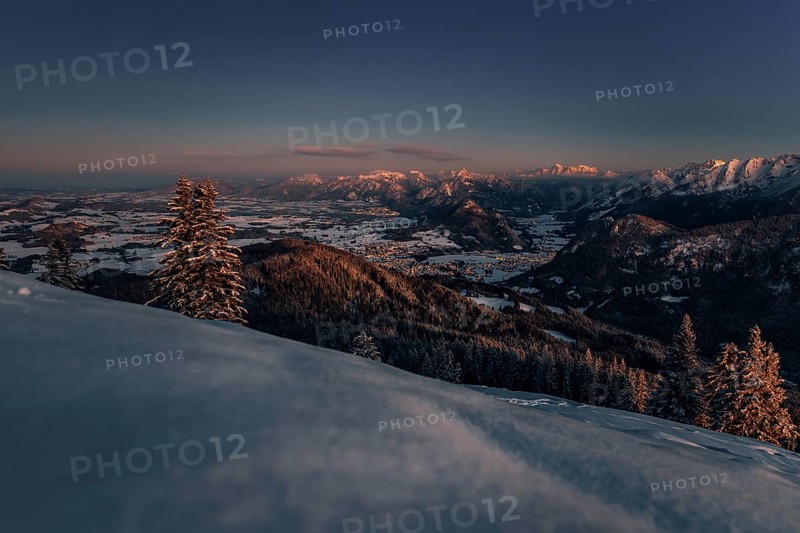 A Winter Wonder Land sunset hiking tour in the snow on the Edelsberg near Nesselwang in the Allgäu in Bavaria, Germany, Europe