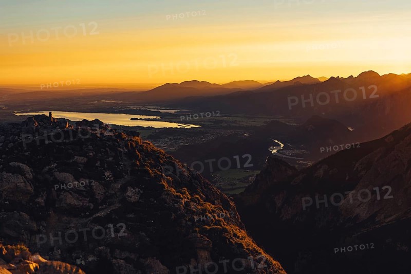 View from the Aggenstein to the Forggensee and the Ammergebirge at sunrise, Bavaria, Germany, Europe