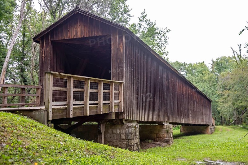 Meadville, Missouri - The Locust Creek Covered Bridge, a state historic site. The bridge was built in 1868. It carried vehicles on Missouri Route 8, a main east-west road, in the early 20th century. The channel of Linn Creek moved after 1945.