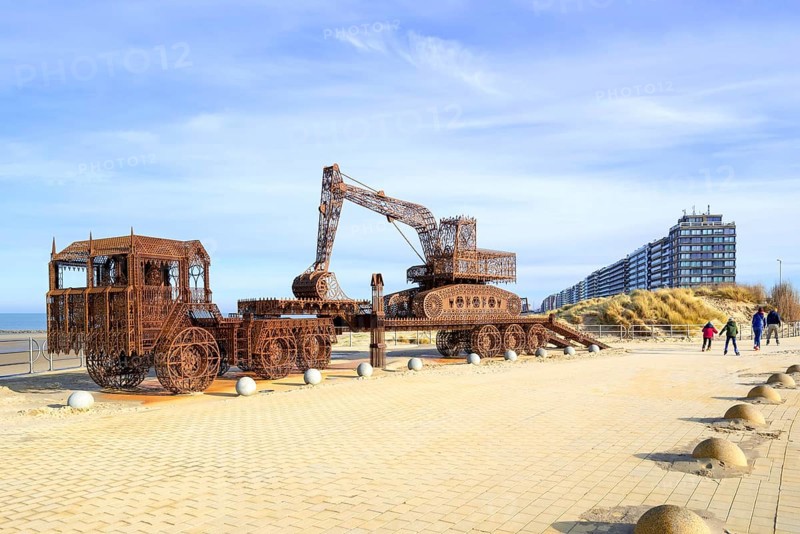 Caterpillar + Flatbed Trailer, artwork by Belgian neo-conceptual artist Wim Delvoye at seaside resort Westende, Middelkerke, West Flanders, Belgium, Europe