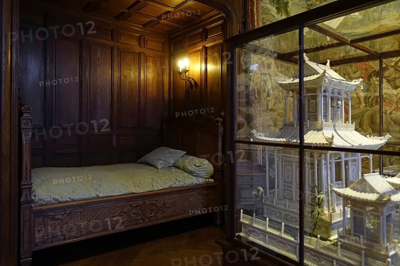 Bed and miniature ivory Chinese pagoda in the Louis XIV room at Kasteel van Gaasbeek, renovated medieval castle in Lennik, Flemish Brabant, Belgium, Europe