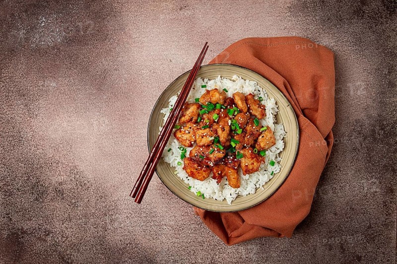 Fried chicken teriyaki with rice, green onion and sesame, homemade, no people