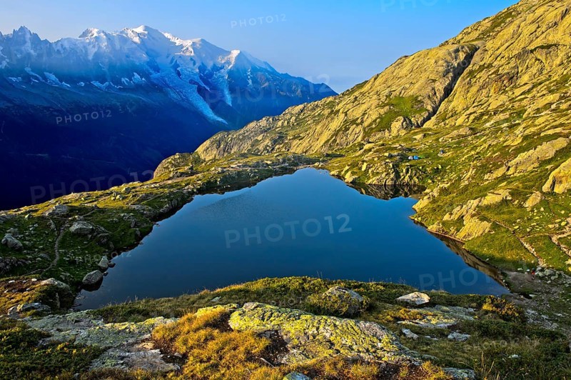 Mountain lake Lacs des Chéserys in the Aiguilles Rouges nature reserve, behind Mont Blanc massif, Chamonix, Haute Savoie, France, Europe