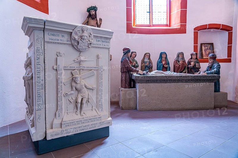 Stone relief of Christ in the winepress and burial group in the Catholic parish church of St Martin in the Ediger district, Ediger-Eller, Rhineland-Palatinate, Germany, Europe