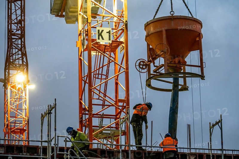 Concrete work, at dusk, on a large construction site building a residential and commercial complex, North Rhine-Westphalia, Germany, Europe