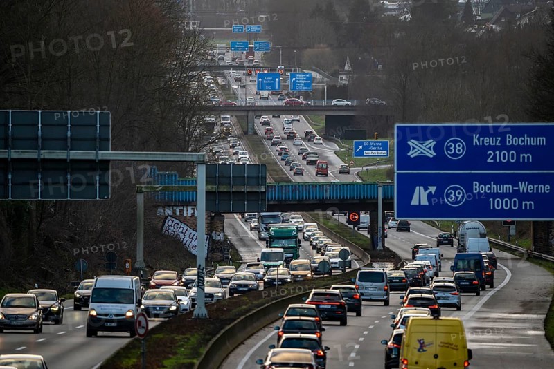 Motorway A40, Ruhrschnellweg, near Bochum, dense evening traffic, in front of the motorway junction Bochum, A43, view in west direction, North Rhine-Westphalia, Germany, Europe