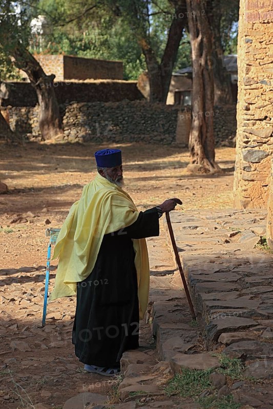 Amhara region, Gondar, Gonder, Moench prays in front of the Debre Berhan Selassie church, Ethiopia, Africa