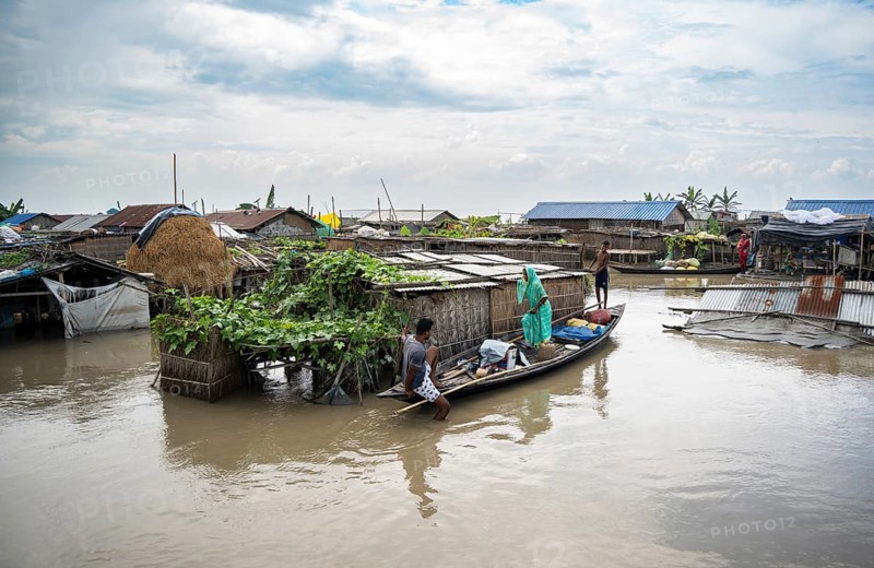 Morigaon, India. 4 July 2024. A settlement is partially submerged in flood in Morigaon district in India's northeastern state of Assam on July 4, 2024. Torrential rains and surging rivers across northeast India have killed at least nine people, with more than 1.5 million people affected