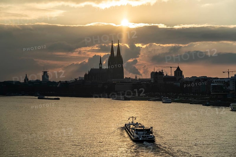 The Rhine near Cologne, sunset, Cologne Cathedral, cargo ship, North Rhine-Westphalia, Germany, Europe