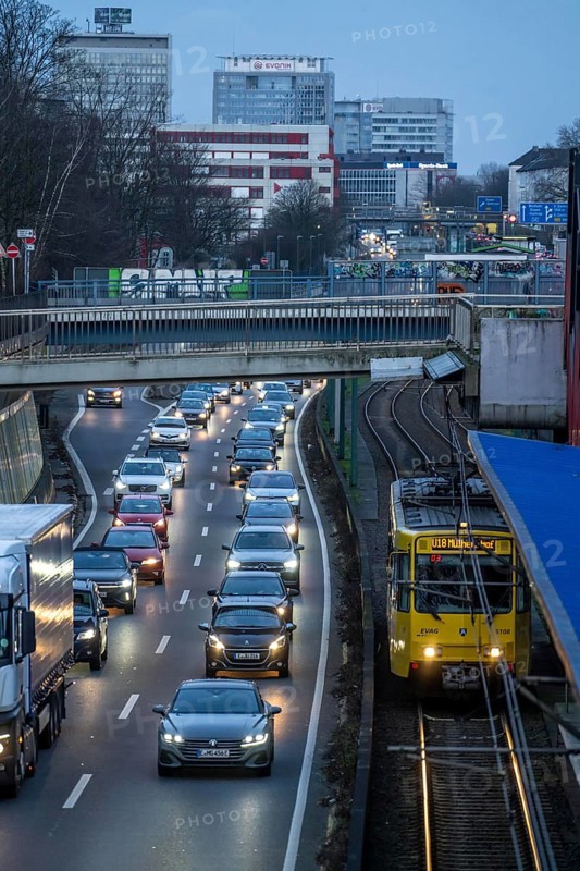 Motorway A40, city centre of Essen, underground line U18, many bridges, for vehicles and pedestrians crossing the carriageway, heavy evening traffic, Essen North Rhine-Westphalia, Germany, Europe