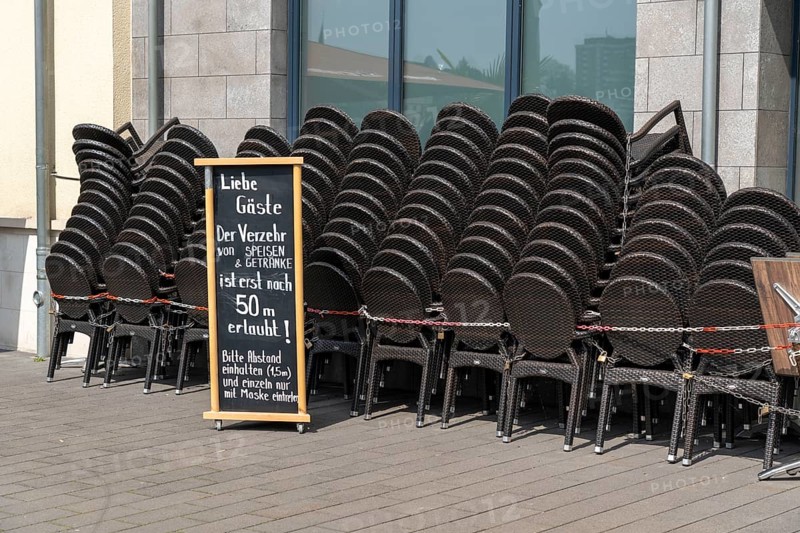 Closed gastronomy, during the Corona condition lockdown in April 2021, outdoor catering, stacked tables and chairs, on the Ruhr promenade, Am Stadthafen Ruhrbahnia, Mülheim an der Ruhr, North Rhine-Westphalia, Germany, Europe