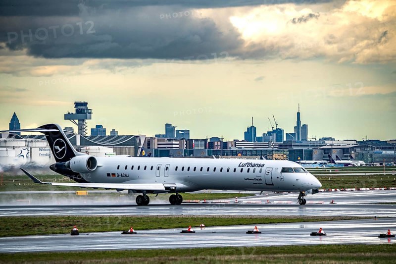 Lufthansa Bombardier CRJ-900, D-ACNJ, taking off on the western runway, skyline of Frankfurt city centre, Frankfurt am Main Airport, FRA, Hesse, Germany, Europe