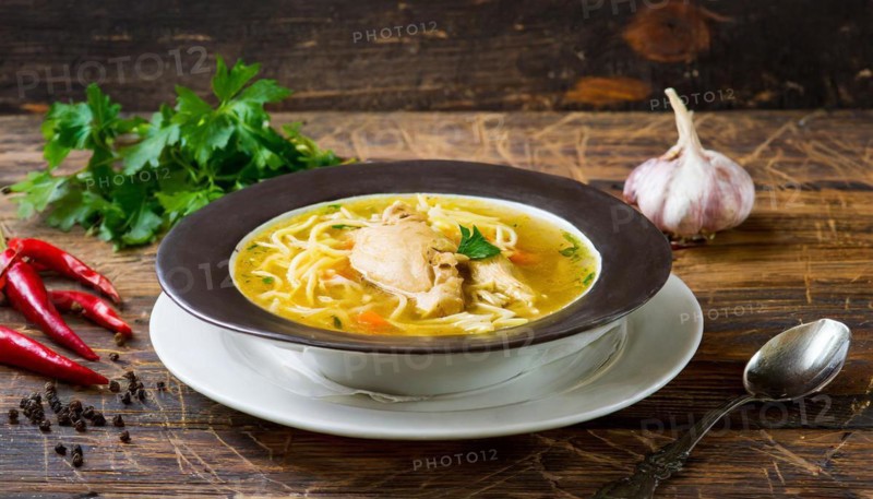 Food, a plate of chicken soup with noodles on a wooden table, AI generated, AI generated