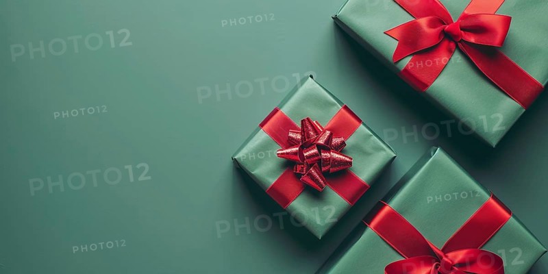 Top view of Christmas gift boxes with red ribbon on green background with copy space. Generative Ai, AI generated