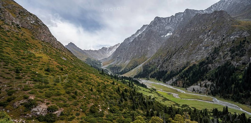 Green mountain valley with river and steep mountain peaks, Chong Kyzyl Suu Valley, Terskey Ala Too, Tien-Shan Mountains, Kyrgyzstan, Asia