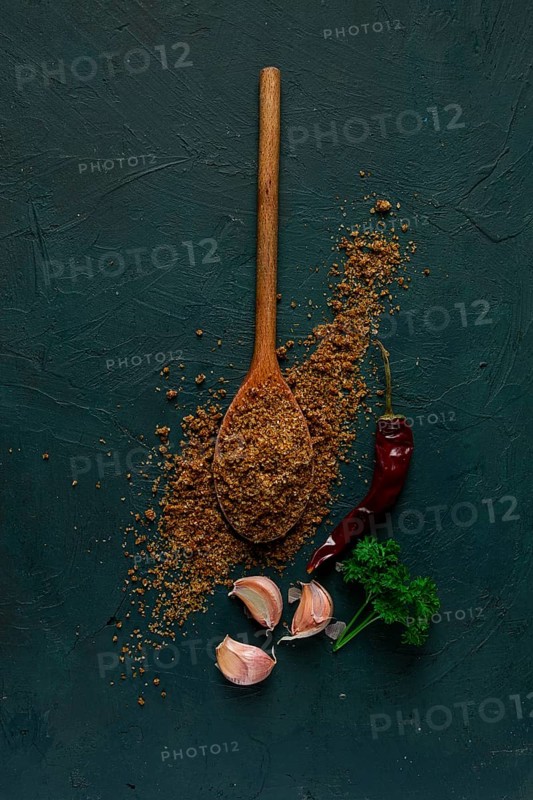 Svan salt, wooden spoon, garlic, red hot pepper, herbs and spices, Georgian cuisine