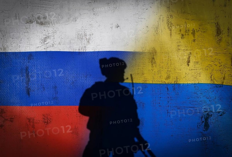 Russia vs Ukraine flag on cracked wall, concept of war between russia and ukraine, silhouette of soldiers on russia vs ukraine flag