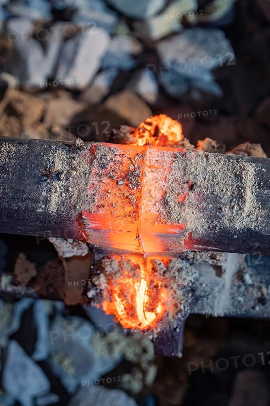 Melting metal flows through the rail interface during welding, rail welding, track construction Hermann Hessebahn, Calw, Black Forest, Germany, Europe