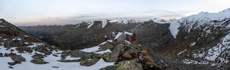 Panorama, Snowy mountain landscape, mountain hut Ramolhaus in autumn with snow, at sunset, view of Gurgler Ferner with summit Hochwilde and Falschungsspitze, Ötztal Alps, Tyrol, Austria, Europe