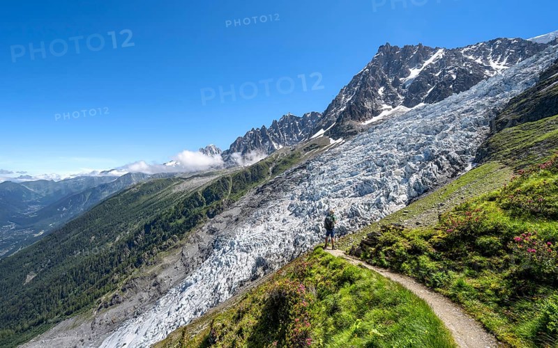 Hiking on the trail to La Jonction, Glacier des Bossons, behind the summit of the Aiguille du Midi, Chamonix, Haute-Savoie, France, Europe