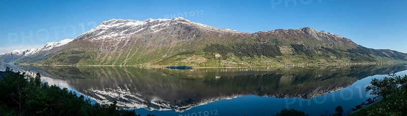 Morning sun over the Sørfjord, a branch of the Hardangerfjord, view from the apple plants at Lofthus to the western shore of the fjord, Hordaland, Norway, Europe