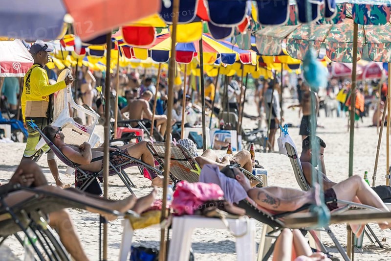 Overtourism in Thailand. Mass tourism on the sandy beach of Patong, the deckchairs are packed closely together. The beach stretches for around three kilometres along the Indian Ocean. Patong, Kathu, Phuket Island, Thailand, Asia