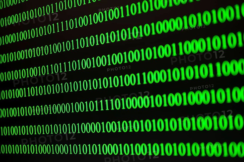 Parallel green binary code lines on a black background