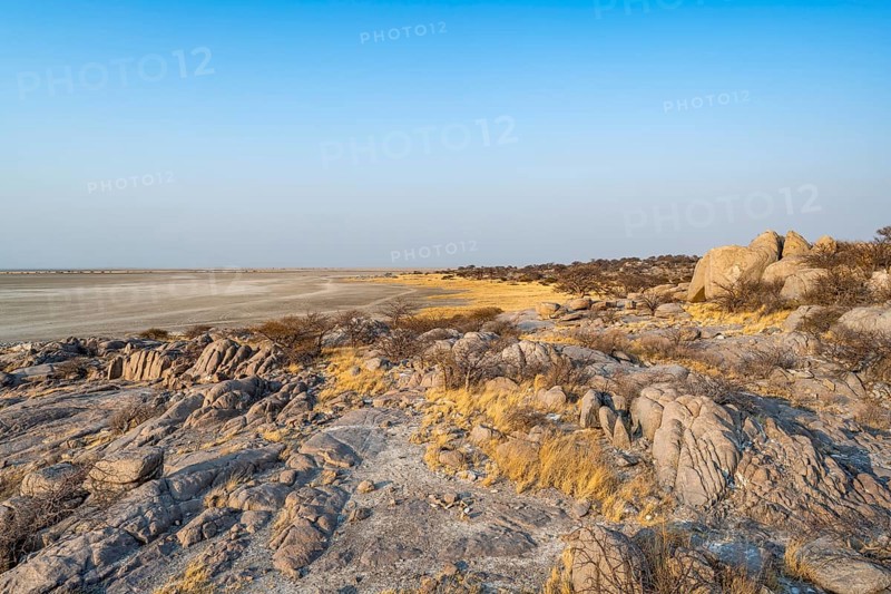 View over round rocks from Kubu Island (Lekubu) to the salt pan, at sunrise, Sowa Pan, Makgadikgadi Salt Pans, Botswana, Africa