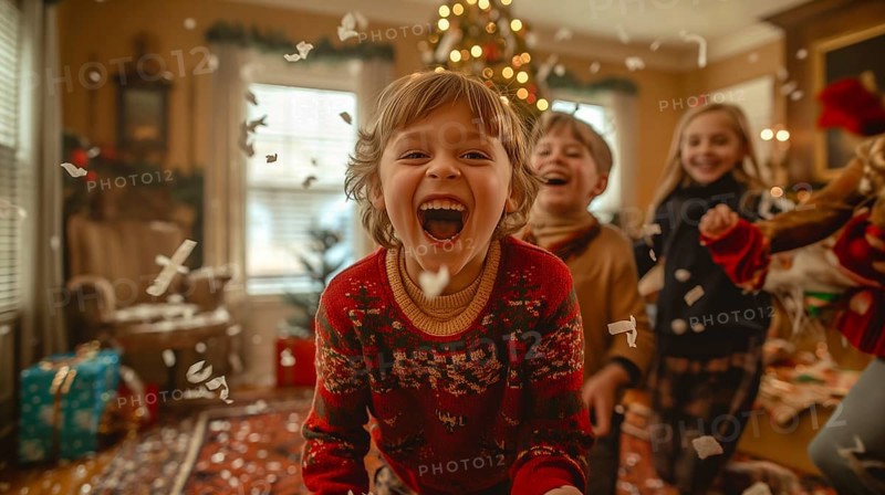 Happy children laughing together on christmas morning amongst the confetti and wrapping paper they threw in the air. generative AI., AI generated