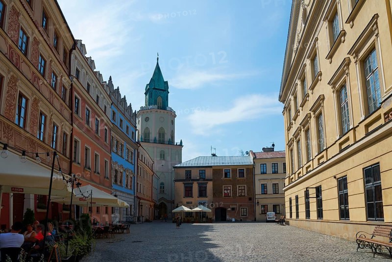 Old town alley with historic tower and buildings, sunny sky and cosy atmosphere, Trinitarian Tower, Trynitarska Tower, Old Town Market Square, Lublin, Poland, Europe
