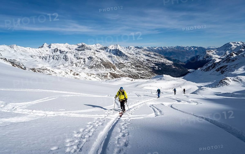 Ski tourers ascending Monte Cevedale, mountain panorama, snow-covered mountain landscape in winter, view into the Martell Valley, high tour, Ortler Alps, Vinschgau Valley, Italy, Europe