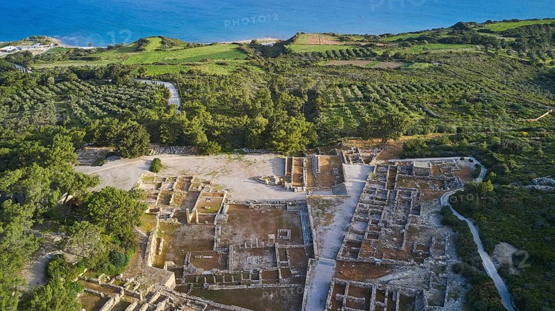 Drone shot, first morning light, aerial view of ancient ruins near the coast, surrounded by green fields and vegetation, Kamiros, Archaeological site, Ancient city, Foundation of Doric Greeks, Rhodes, Dodecanese, Greek Islands, Greece, Europe