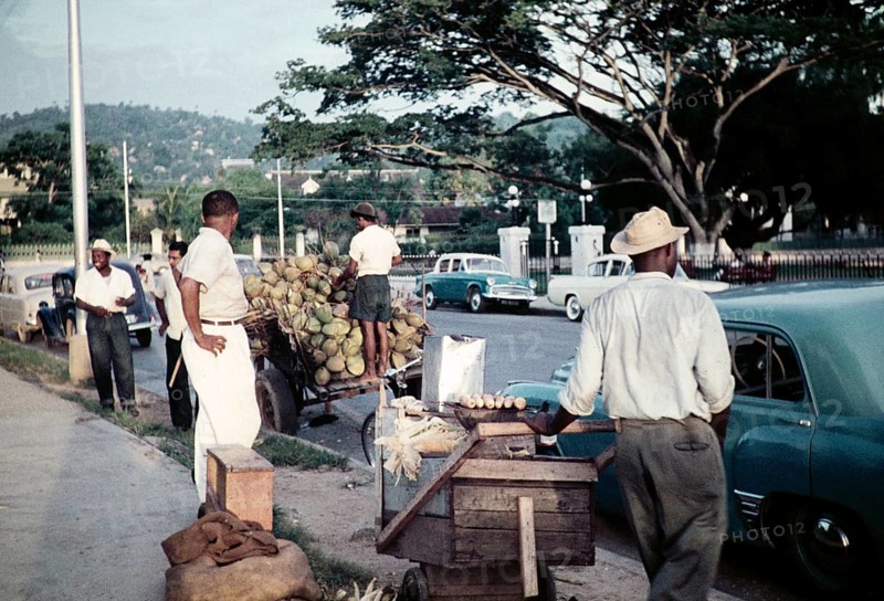 Street traders on pavement opposite Queen's Park Savannah, Port of Spain, Trinidad, 1963