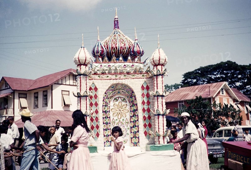 Hosay celebration, also Husayn or Hussein, Shia Muslim remembrance of Muharram, drumming and procession of tadjah floats model mausoleums or Mosque shaped model tombs, Trinidad 1961