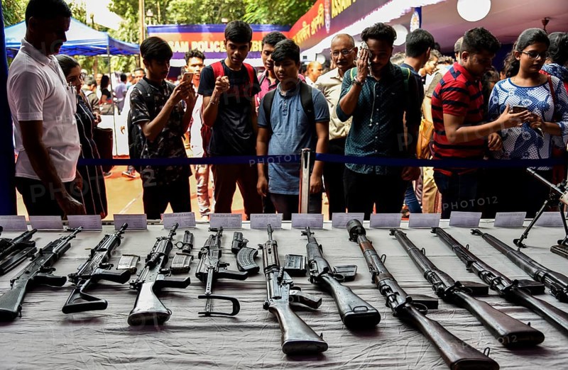 Students visit an arms stall during an exhibition to commemorate Assam Police Day, in Guwahati, Assam, India on Friday, Sept 28, 2018