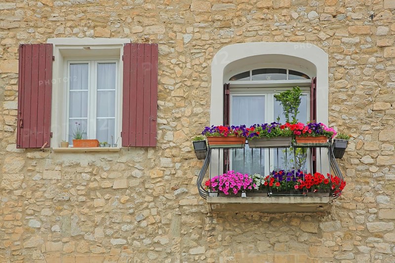 Window with balcony and flower decoration, shutters, balcony railing, two, idyll, house wall, Pernes-les-Fontaines, Vaucluse, Provence, France, Europe